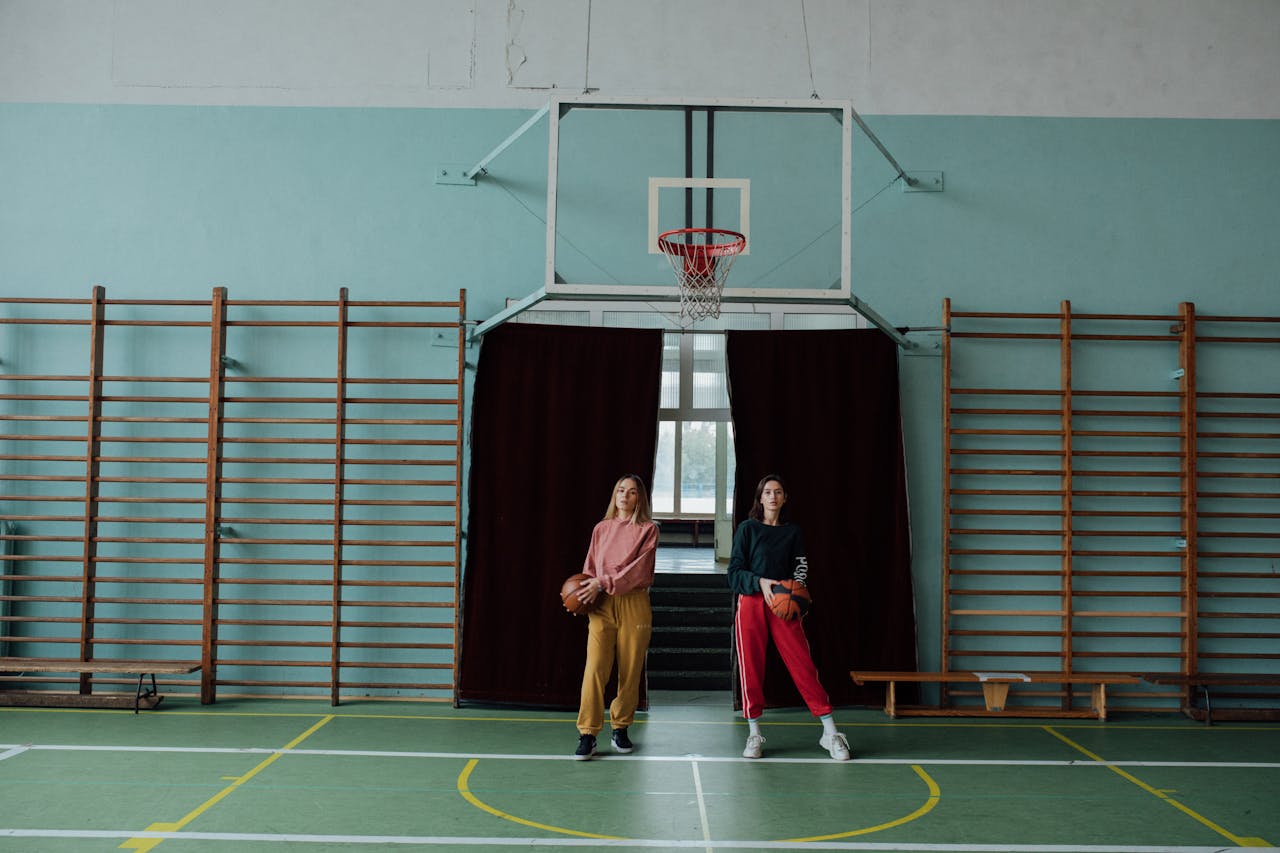 Women Playing Basketball at School